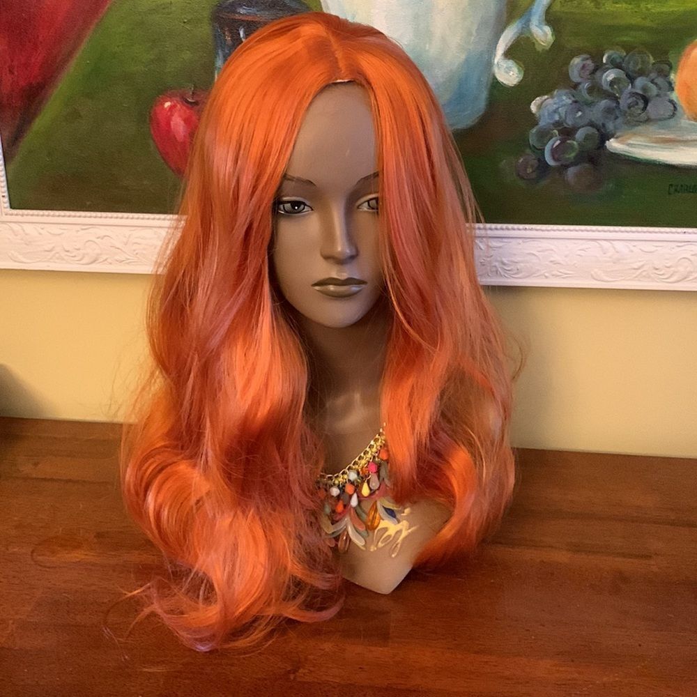 Reddish orange, long wavy, synthetic wig